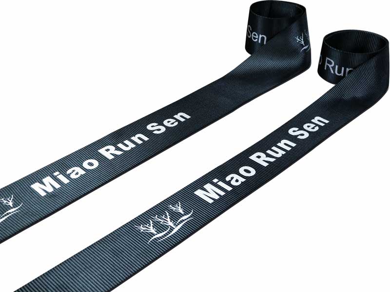 Example of polyester tape, this time in black with white company logo imprint, made by Miao Run Sen